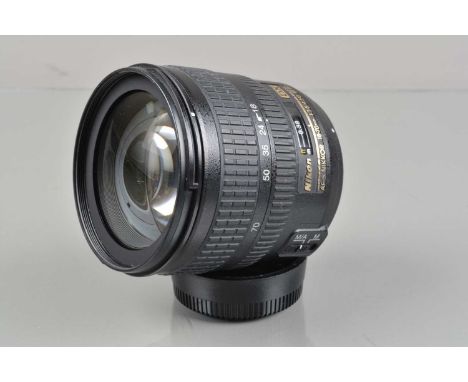 A Nikon DX AF-S Nikkor 18-70mm f/3.5-4.5G ED Lens, auto focus working, barrel G-VG, light fading to grip, elements G-VG, with