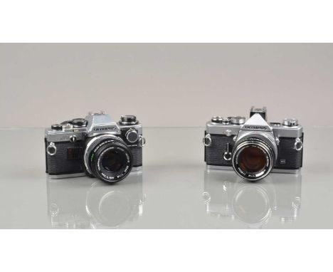 Two Olympus OM Cameras, an Olympus OM-1n, film advance lever jammed, meter responsive, body G-VG, with G Zuiko 50mm f/1.4 len