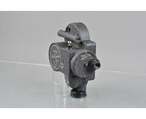 An Ensign 16mm Type B Auto Kinecam Camera, motor runs, no key, body G, with Cinar Anastigmat 1 inch f/2.6 lens, elements G