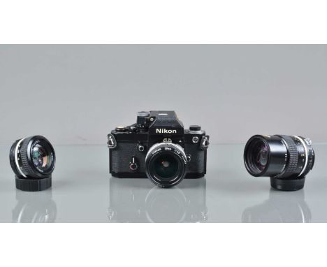 A Nikon F2A Photomic SLR Camera, black, serial no 7762371, shutter working, self timer working, body G, some light wear, with