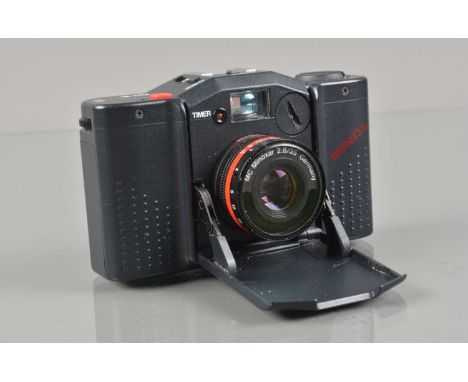 A Minox GT-E Compact Camera, shutter working, meter responsive, self timer working, body G-VG, elements G-VG