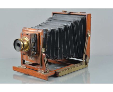 A Mahogany &amp; Brass Half Plate Camera, retailed by Spiers &amp; Ponds Stores Queen Victoria ST E.C, double extension,  bel