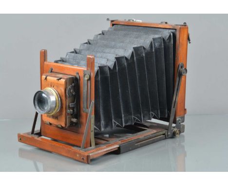 A Mahogany &amp; Brass Half Plate Camera, no visible maker's/retailer's mark, bellows G, no focus screen, some tarnishing to 