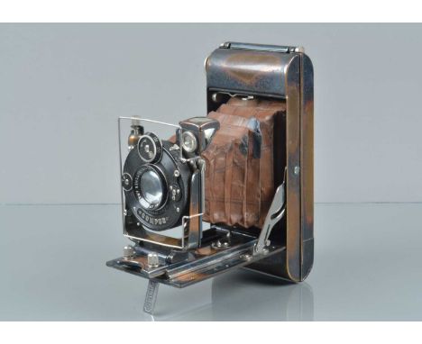 A Butchers No 6 Watch Pocket Tropical Model Folding Camera, body G, missing cable release mount from bed, some staining to be