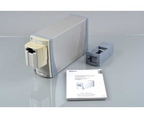 A Nikon Coolscan V ED Film Scanner, powers up, with SA-21 &amp; MA-21 adapters, USB cable, power cable, softwear discs and ma