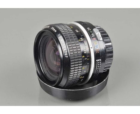 A Nikon Nikkor 28mm f/2.8 Non Ai Lens, serial no 384707, barrel G, some light paint wear, elements G, with L1A filter, lens h