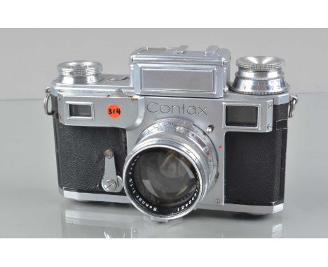 A Zeiss Ikon Contax III Rangefinder Camera, shutter working, sluggish to return in bulb. meter responsive, self time not firi