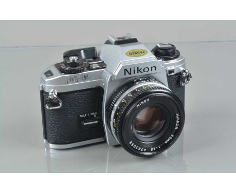 A Nikon FG-20 SLR Camera, serial no 3480514, shutter working, meter responsive, self timer working, body G-VG, light marks to