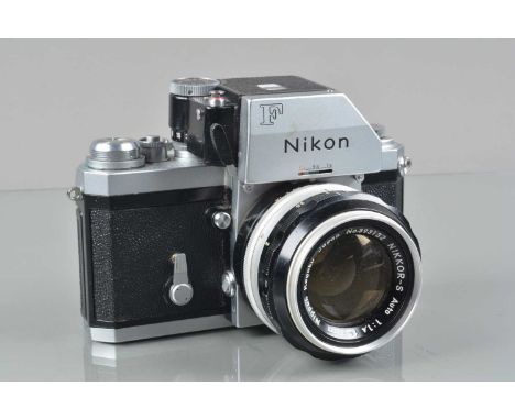 A Nikon F Photomic FTN SLR Camara, serial no 7302398, shutter working, meter responsive, self timer working, body G, light we