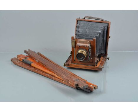 A Mahogany &amp; Brass Half Plate Camera, tarnishing to brass, missing securing bolt to r/hand side of back, bellows F, with 