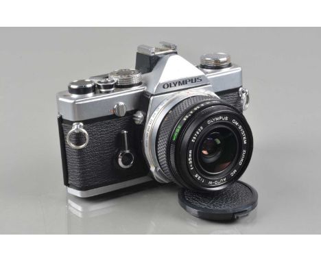 An Olympus OM-1 SLR Camera, shutter working, meter responsive, self timer working, body G, missing drive cover, with Zuiko MC