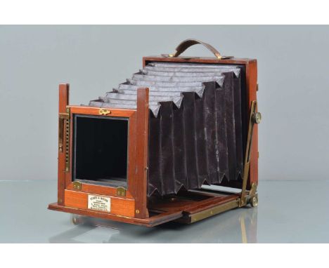 A Mahogany &amp; Brass Half Plate Camera, retailed by Stokes &amp; Watson Manchester, with later black focus screen back, red