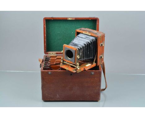 A Lancaster &amp; Son ''The 1903 B. B.Instantagraph''Quarter Plate Mahogany and Brass Camera,  brass bound, some dulling to b