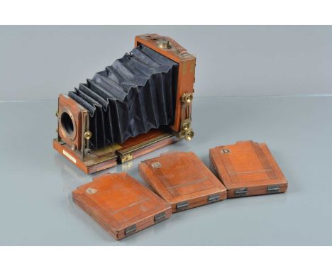 A Lancaster special Instantograph Mahogany &amp; Brass Quarter Plate Camera, brass bound, with later added brass level bubble