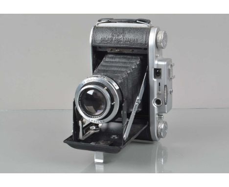 An Ensign Selfix 820 Special Rangefinder Folding Camera, shutter working, rangefinder functions, body G, bellows G, some wear