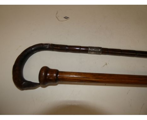 Walking Stick with possibly Silver Collar together with a Walking Cane