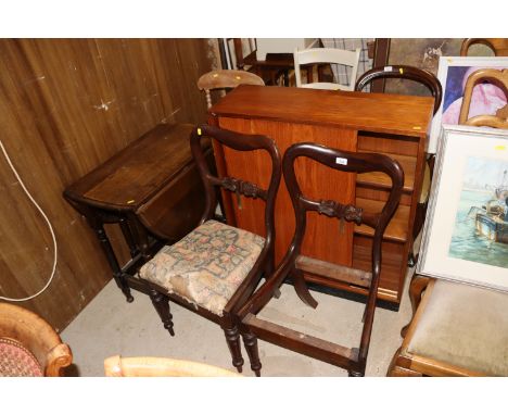 A pair of Victorian dining chairs (one without seat), a teak bookcase with sliding glass doors and a gate leg table