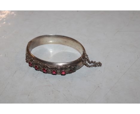 A vintage white metal and paste stone set bangle, approx. total weight 33gms 