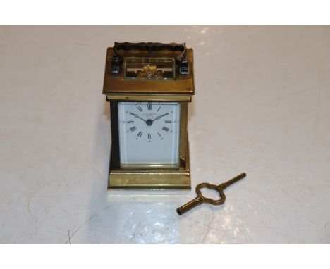 A French brass cased carriage clock retailed by J.A. Haskell Ipswich 