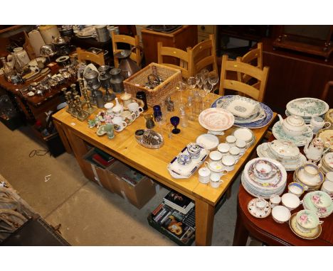 A light oak extending kitchen dining table with two extra leaves and six matching ladder back chairs 