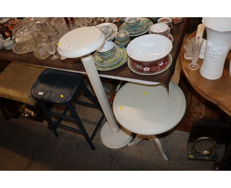 A cream painted torchere stand and a circular tripod occasional table 