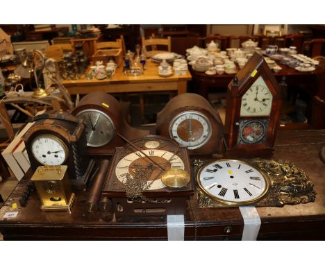 An American steeple clock; a French embossed brass and enamel clock face; a Tempus Fugit wall clock; three mantel clocks and 