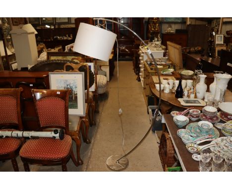 A modern design chrome floor lamp of arched design