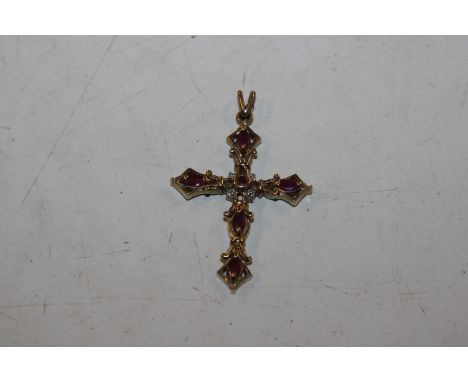 A 9ct gold ruby and chip diamond crucifix pendant AF, approx. total weight 4.2gms 