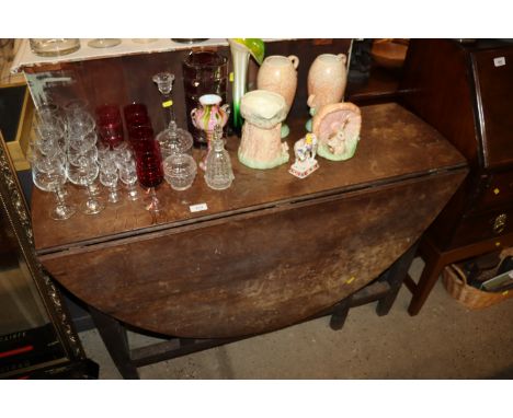 An antique gate leg table