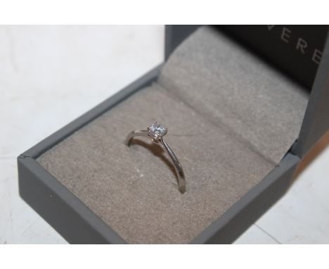 A 9ct white gold solitaire ring, set with white stone 1gms total weight, size O/P