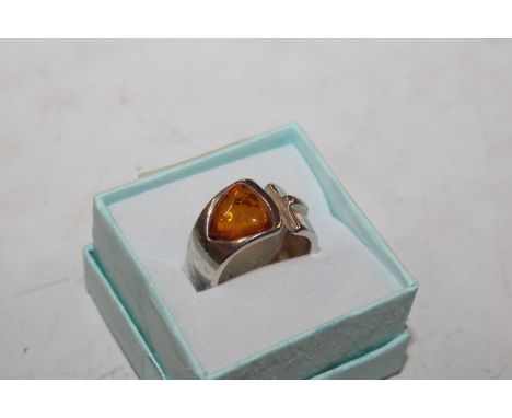 A Sterling silver and amber modernist ring, ring size L/M