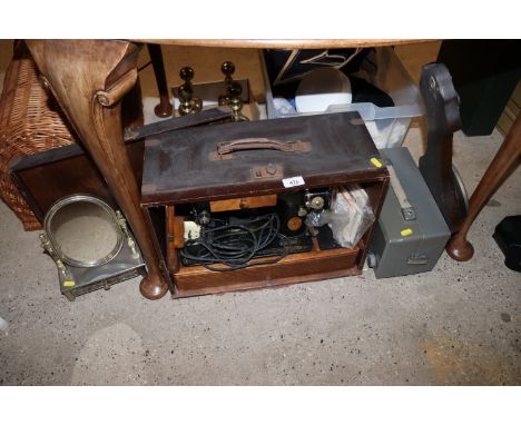 A Singer sewing machine - sold as a collector's item; a swing toilet mirror; a barometer and a trioscope