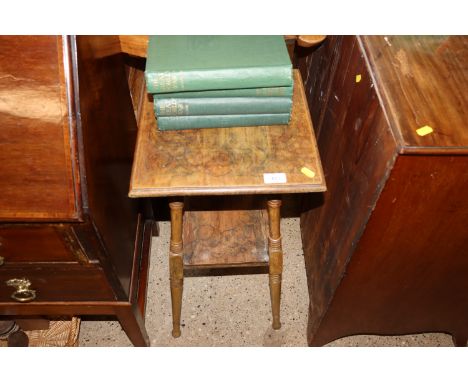 An Edwardian two tier plant stand with poker work style decoration 