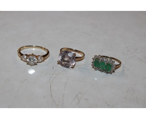 A 9ct gold ring set with green and white stones, ring size L, 2.2gms total weight; a 9ct gold ring set with coloured stone, r