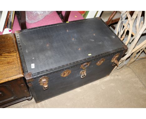A dark blue trunk and miscellaneous contents 