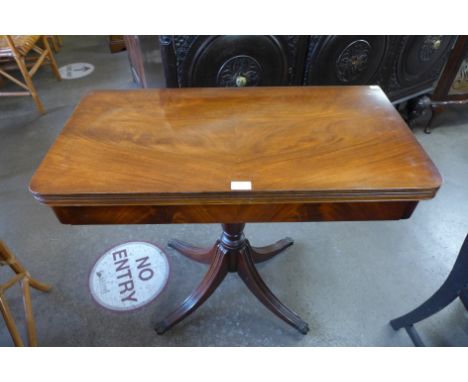 A Regency style mahogany fold over card table 