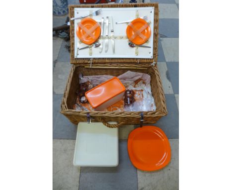 A wicker cased picnic hamper 