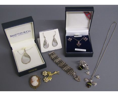 Collection of silver jewellery includes filigree mounted shell pendant and matching earrings, thistle earring and necklace se