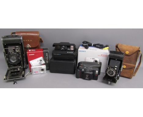 Collection of cameras - Zeiss Ikon, Casio Exilim, Polaroid image system SE, Minolta AF-DL, Ensign and Cybershot box only with