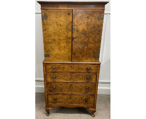 Early 20th century drinks cabinet in the Queen Anne style in burr walnut veneer Ht 157cm W 76cm D 149cm