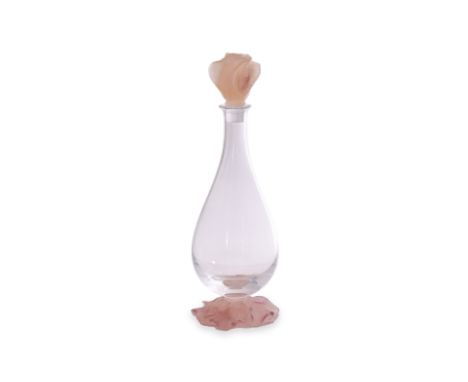 A DAUM PATE DE VERRE AND CLEAR GLASS DECANTER
Floral stopper, pear shaped clear glass body and on foliate base, signed to bas