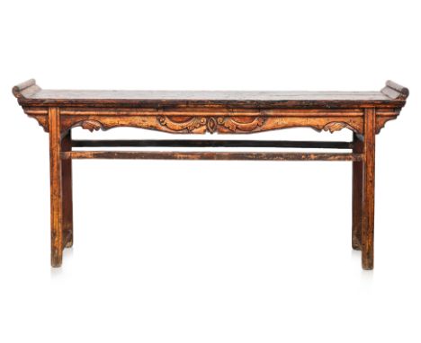 A CHINESE ELM ALTAR TABLE
Scroll ends and carved, shaped apron, raised on rectangular supports
L 213 D 40 H 85cm
This is an a