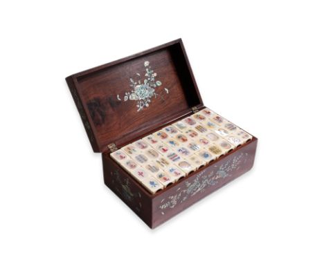 A MAHJONG SET WITH MOTHER OF PEARL INLAID HARDWOOD BOX The rectangular hardwood box with mother of pearl inlaid foliate decor