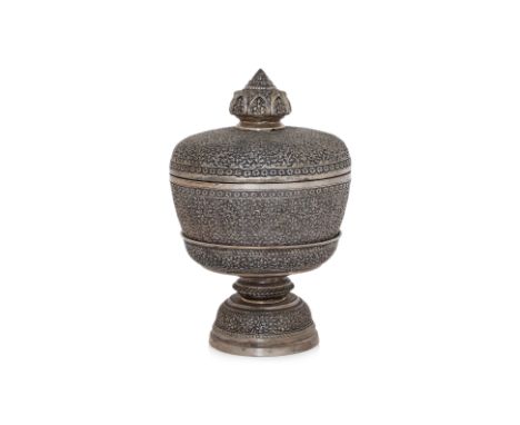 A LARGE THAI SILVER PLATED BOWL, COVER AND STAND
Repoussé and chased with dense foliate scrollwork, raised on a lotus pedesta