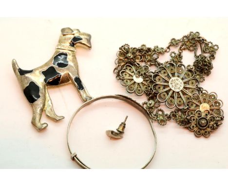 Decorative silver coloured necklace, a silver coloured Christening bangle and a silver coloured dog brooch. P&amp;P Group 1 (