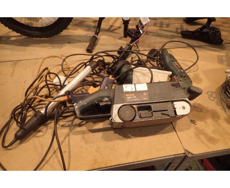 Bosch PBS 75 belt sander, Bosch PHG 2 heat gun, Bosch PDA 240E detail sander, a glue gun and a inspection lamp. Not available