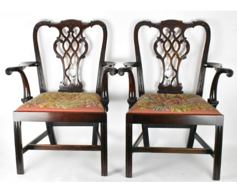 A pair of late 19th century mahogany Chippendale style carver chairs, carved with C scrolls, egg and dart moulding, scrolled 