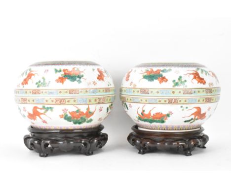 Two Chinese famille rose circular formed lidded boxes, early 20th century, decorated in polychrome enamels with a five claw d