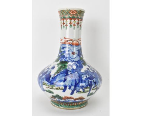 A Chinese Famille Vert bottle neck vase, decorated with figures, horse and butterflies in a landscape scene with Famille Vert