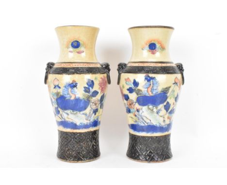 A pair of Chinese Nanking crackle glazed vases, Qing dynasty, late 19th century, baluster form with a flared rim and ring sha